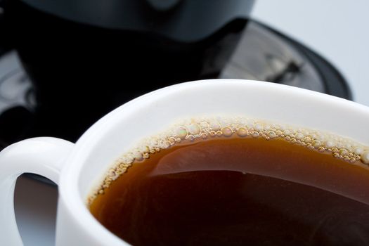 close-up white and black cups with tea