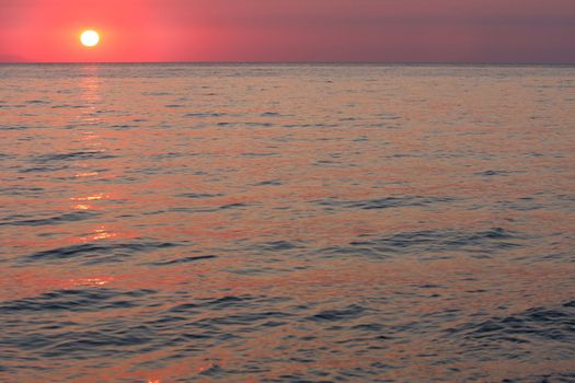 details of ocean and sunrise in Greece