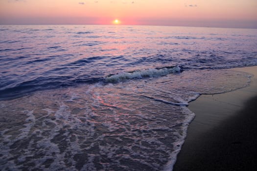 details of ocean and sunrise in Greece