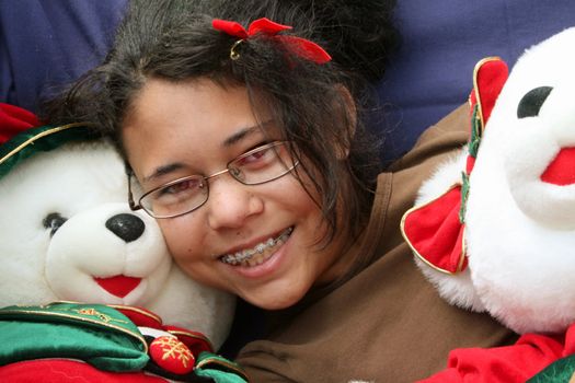girl with stuffed Christmas bears