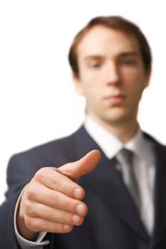 Young business man handshake with focus on the hand, isolated over white