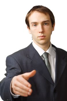 Young business man hand shake with focus on face, isolated over white
