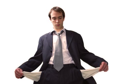 Young business man shows his empty pockets, isolated over white