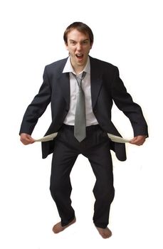 Young man shouts showing his empty pockets, isolated over white