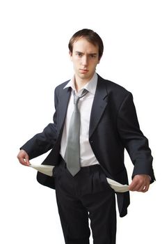 Young business man shows his empty pockets, isolated over white