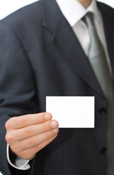 Young professional shows his business card