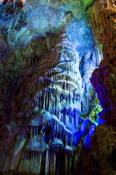 Image of stalactite and stalagmite formations all lighted up at Reed Flute Cave, Guilin, Guangxi Zhuang Autonomous Region, China.