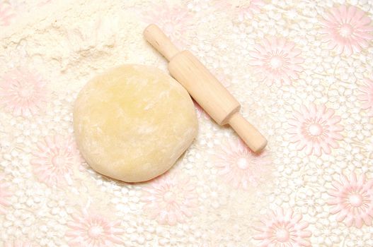 floured rolling pin on dough