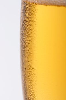A closeup shot of a fresh, cold beer isolated on white background