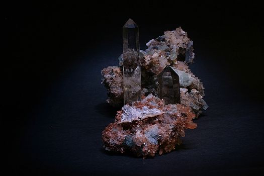 Crystal and stone on a black background.