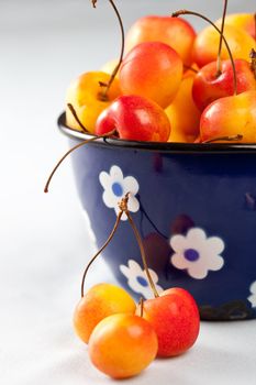 Delicious rainier cherries in a small old pan