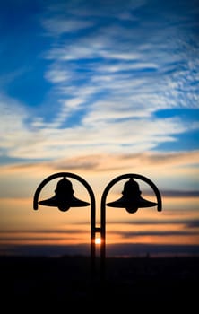 old lantern at sunset time with nice colored sky at background