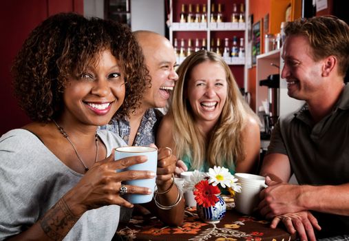 Pretty African American Woman in Coffee House with Friends