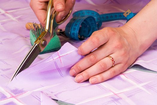 dressmaker cuts scissors fabrics