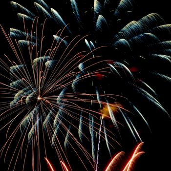 Firework streaks in the night sky during celebrations.