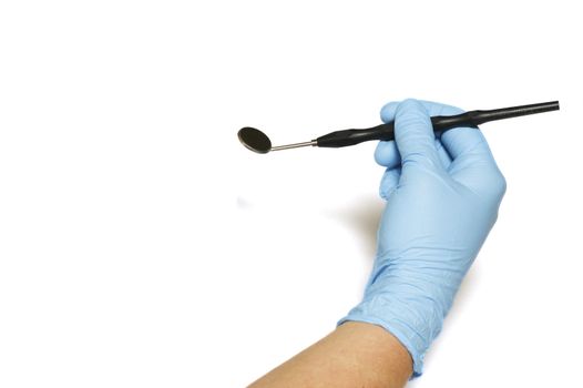 A dentist hand holding a mirror