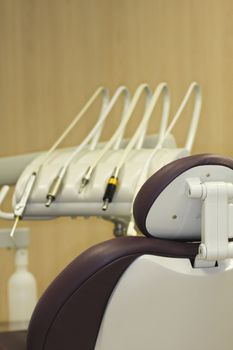 a modern dentist chair with tools