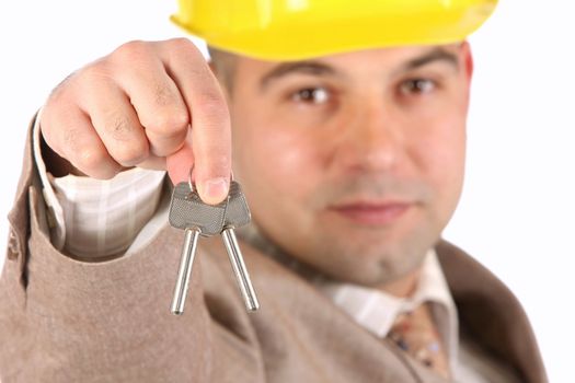 A businessman with keys on white background