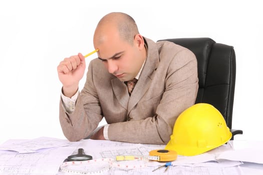 Businessman thinking with architectural plans on white background