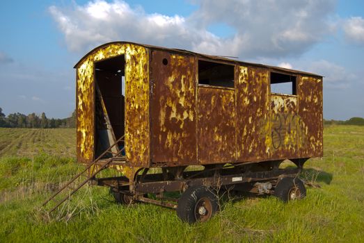 An old trailer in a green land in Italy near Rome