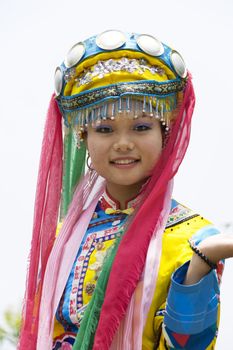 Image of a young Chinese girl in traditional ethnic dress at Yao Mountain, Guilin, China.