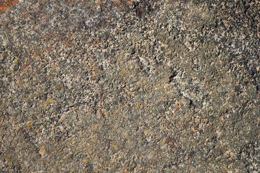 Fragment of rustic dark flat stone surface texture