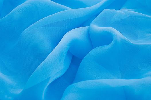 Blue tones of silk fabric folded