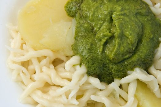 Trofie with pesto is a typical Ligurian food often accompanied by potatoes or green beans. Pesto is a sauce made of basil, parmesan and pine nuts