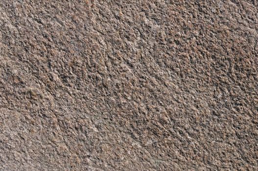 Fragment of natural brown stone surface texture