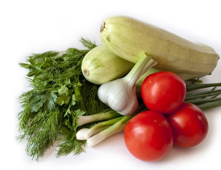 vegetable still life consisting of zucchini, tomato, garlic and herbs