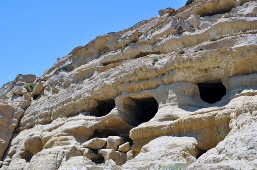 Travel photography: Cave, tombs, ancient roman cemetery in Matala, Crete, 

Greece.