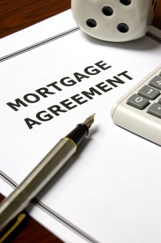 Image of a mortgage agreement on an office table.