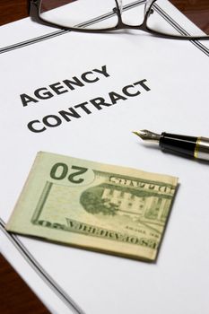 Image of an agency contract on an office table.