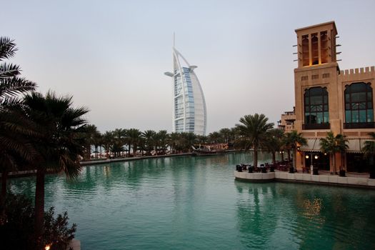 Burj al Arab hotel reflected in lake in Dubai