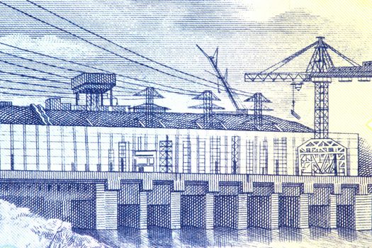 Macro image of a hydro electric power station on an old currency note.