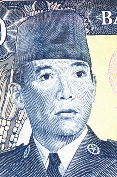 Macro image of President Suharto of Indonesia on an old currency note.