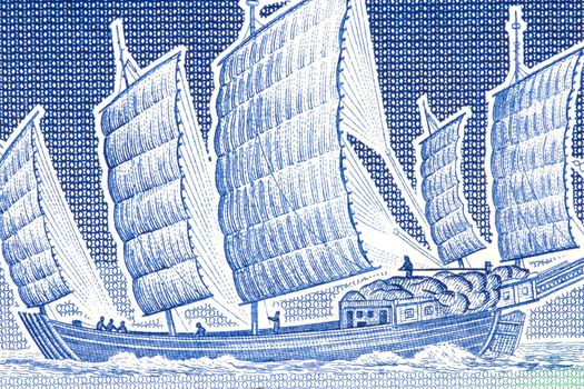 Macro image of a chinese junk on an old currency note.