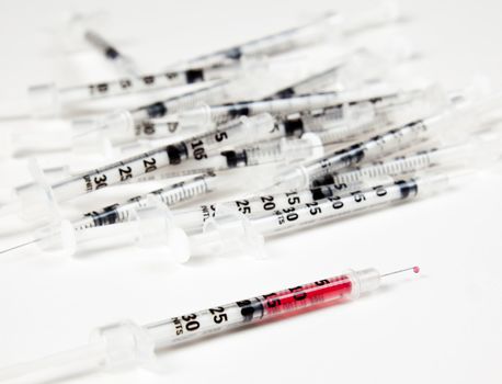 Pile of discarded injection syringes after immunization