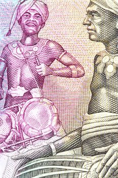 Macro image of tribal drummers on a currency note.