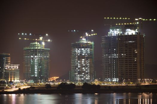 Night image of buildings under construction in Malaysia.