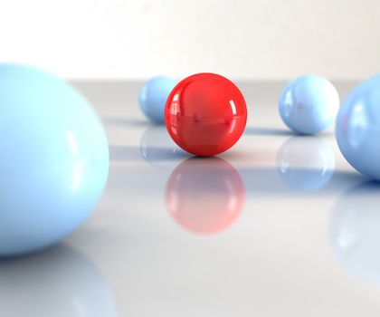 A red ball with other blue around