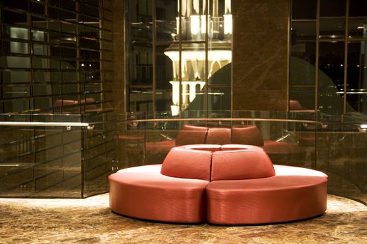 Image of a modern round red sofa