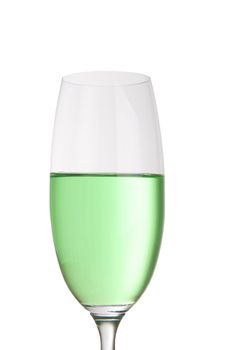 Bright green drink in a tall champagne glass