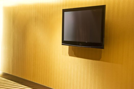Image of a flat screen television mounted on a wall.