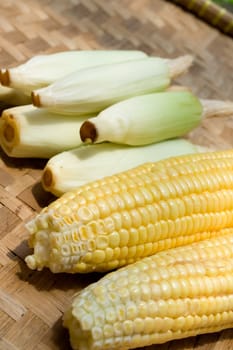 variety of corn on traditional bamboo tray