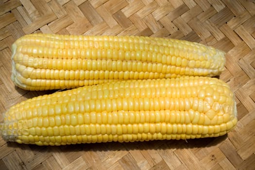 corn arrangement on traditional bamboo tray