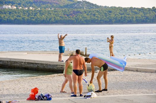 People have a rest at coast of Adriatic sea in Croatia 