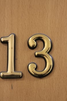 Close up of the Number 13 on the wall.