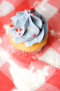 delicious cupcake on a table cloth