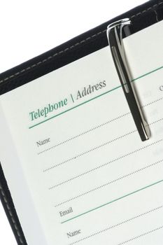 Isolated image of a telephone and address book.